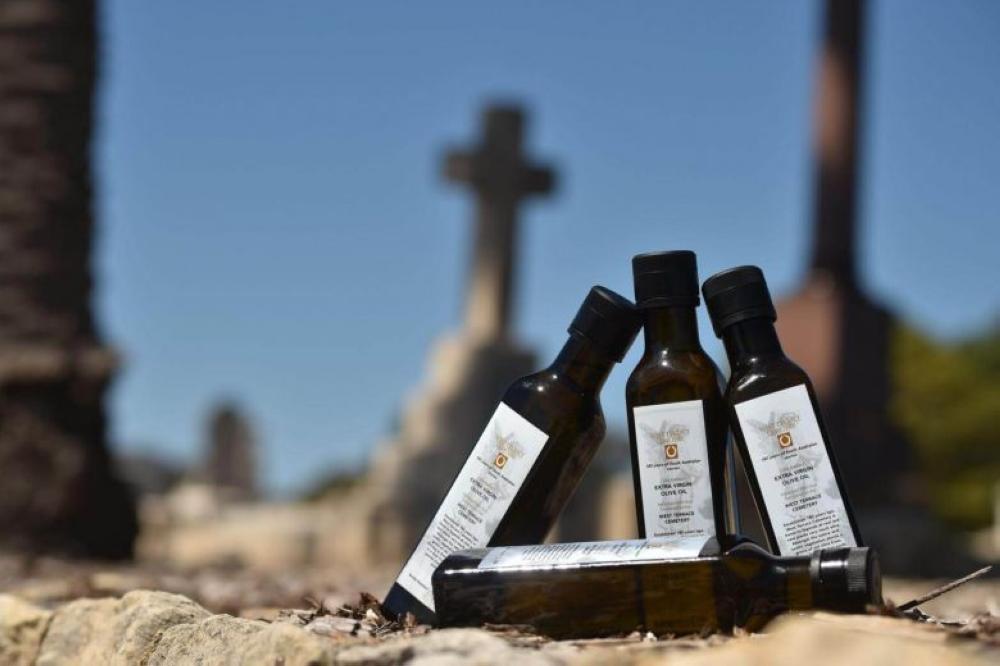 The last four bottles of 2017 limited-edition olive oil released to mark the 180th anniversary of the West Terrace Cemetery in Adelaide on Sept. 27. - AFP