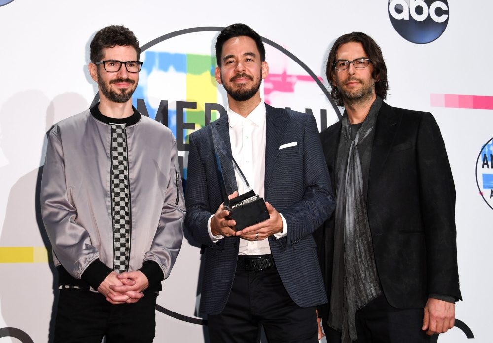 American Music Award for Favorite Alternative Rock Artist winners, from left, Brad Delson, Mike Shinoda and Rob Bourdon of Linkin Park pose in the Press Room at the 2017 American Music Awards, on Sunday, in Los Angeles, California. - AFP