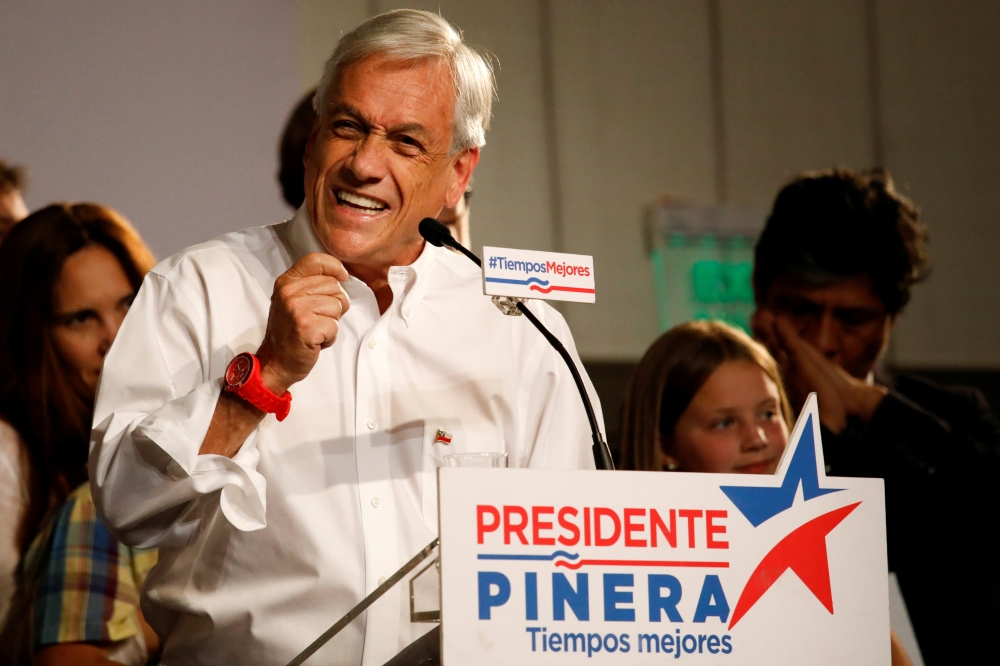 Chilean presidential candidate Sebastian Pinera delivers a speech to supporters after leading in the first round of general elections in Santiago, Chile, on Sunday. — Reuters