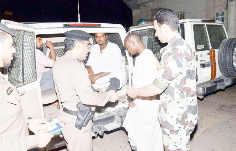 Some of the rounded up illegal expatriates in Asir. — Okaz photos