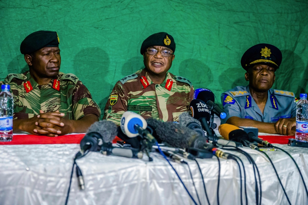 Zimbabwe’s Commander Defense Forces General Constatntino Guveya Chiwenga, center, speaks during a press conference at the Tongogara Barracks in Harare, Zimbabwe on Monday. — AFP