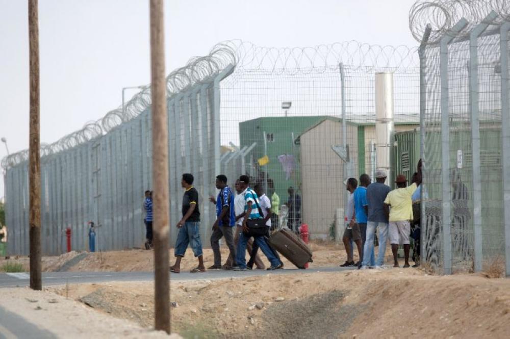 A file picture shows African migrants gathering before their release from the Holot detention center.