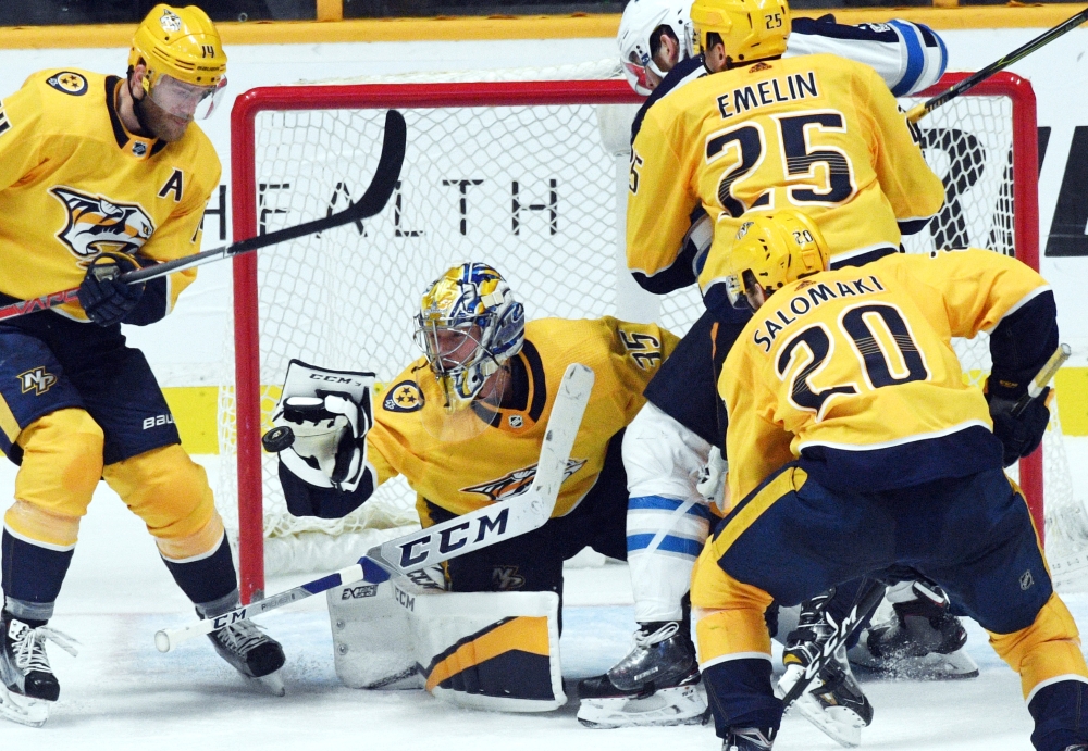 Nashville Predators goalie Pekka Rinne (35) makes a save during the third period against the Winnipeg Jets at Bridgestone Arena. — Reuters