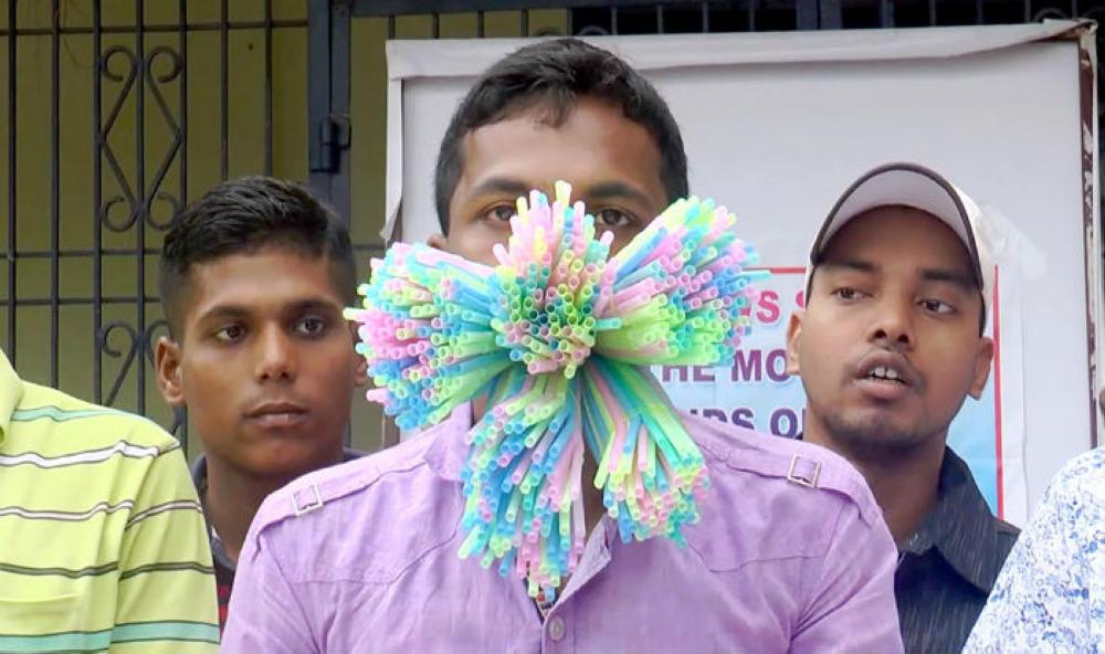 Manoj Kumar Maharana is seen with 459 straws in his mouth during an event to set a new Guinness World Record in Odisha, India on Monday.