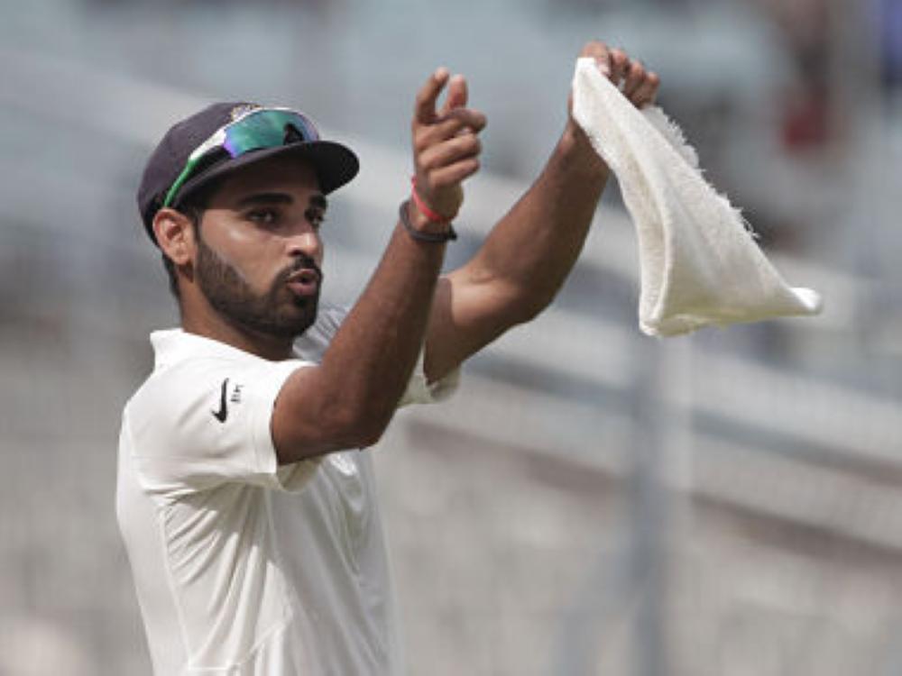 India's Bhuvneshwar Kumar gestures to his teammates during the fourth day of their first Test cricket match against Sri Lanka in Kolkata, India. — AP