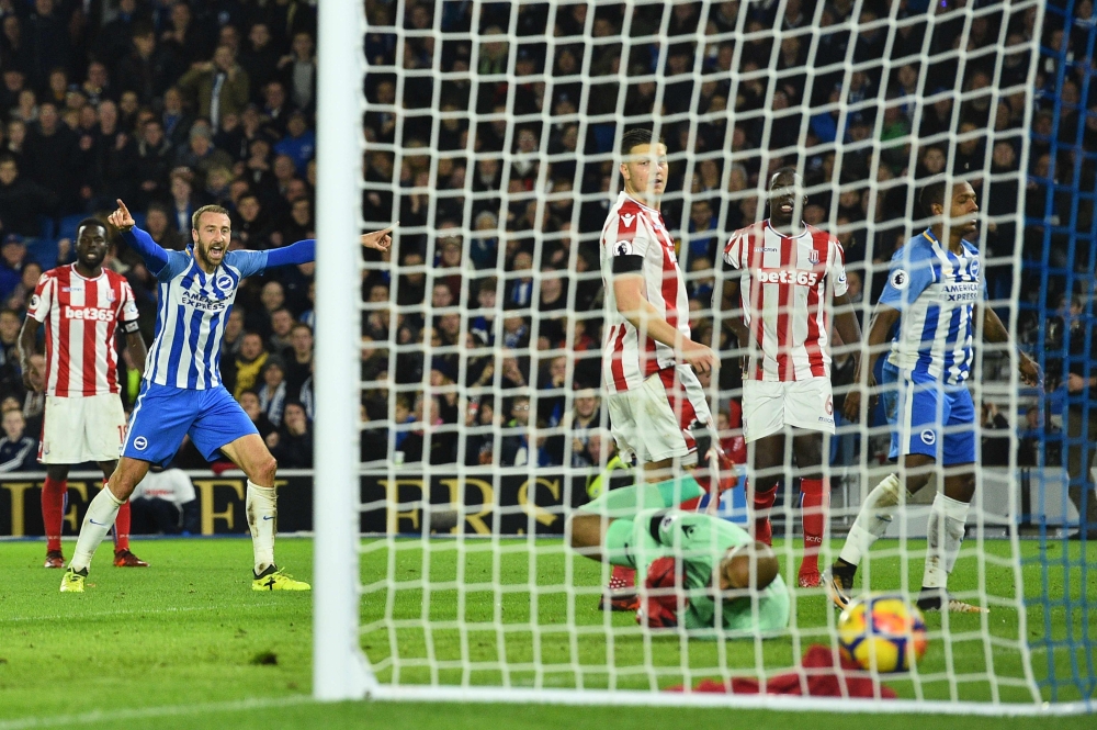 Brighton's Spanish midfielder Jose Izquierdo (R) turns away after scoring an equalizing goal for 2-2 during the English Premier League football match between Brighton and Hove Albion and Stoke City at the American Express Community Stadium in Brighton, on Monday. — AFP
