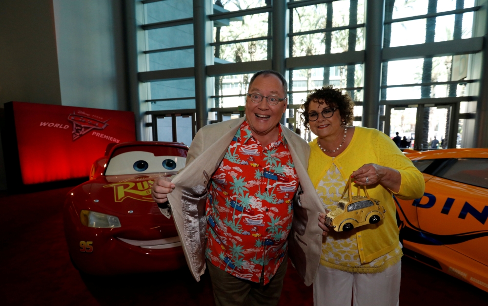 John Lasseter, Chief creative officer of Pixar and his wife Nancy pose at the premiere of 