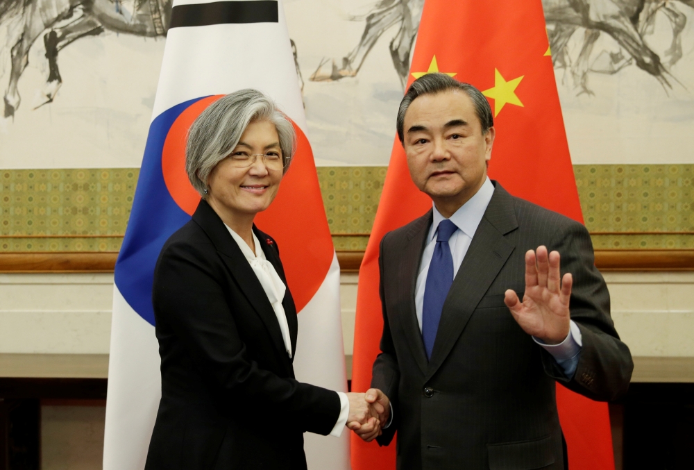 China’s Foreign Minister Wang Yi, right, meets South Korean Foreign Minister Kang Kyung-wha at Diaoyutai State Guesthouse in Beijing on Wednesday. — Reuters