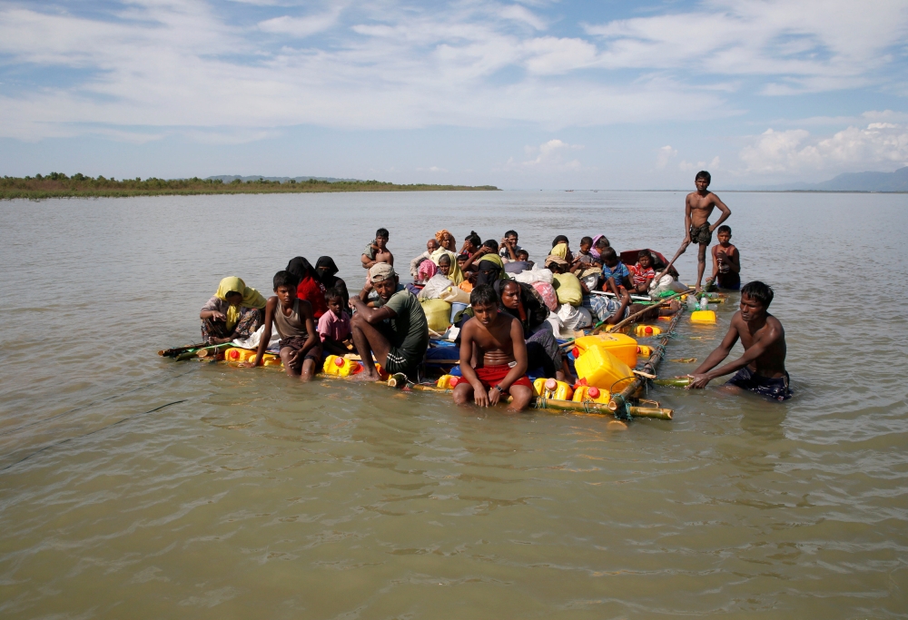 Rohingya refugees sail towards the bank of Naf River on a makeshift raft after crossing the Bangladesh-Myanmar border, at Sabrang in Teknaf, near Cox’s Bazar, Bangladesh, in this Nov. 11, 2017 file photo. — Reuters