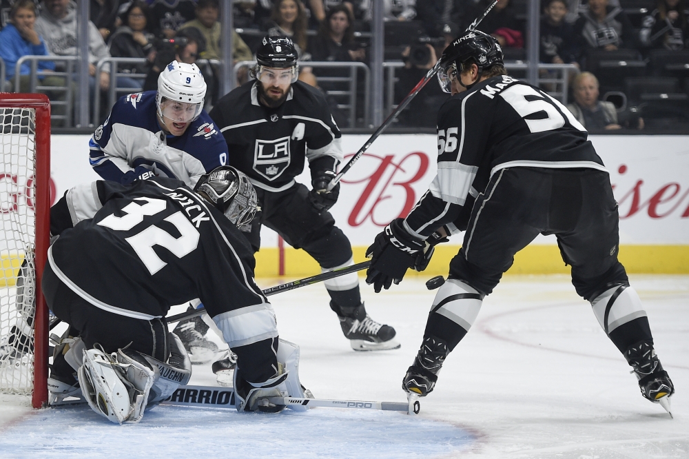Los Angeles Kings goalie Jonathan Quick (32) blocks a shot by Winnipeg Jets center Andrew Copp (9) during the first period at Staples Center. — Reuters