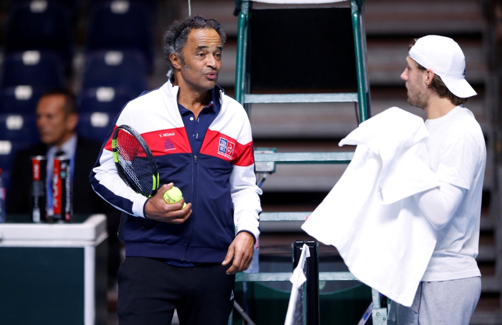 France captian Yannick Noah during training for the France-Belgium Davis Cup final at Lille, France, on Friday. — Reuters