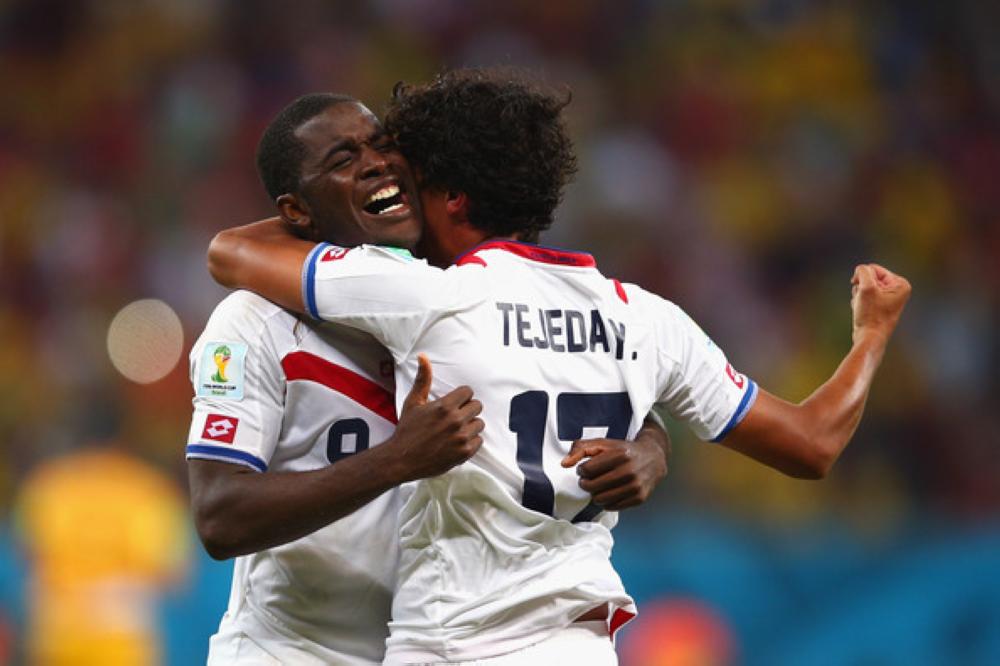 Joel Campbell (L) and Yeltsin Tejeda of Costa Rica celebrate after defeating Greece in a penalty shootout during the 2014 FIFA World Cup Brazil Round of 16 match in Recife, Brazil. — Reuters