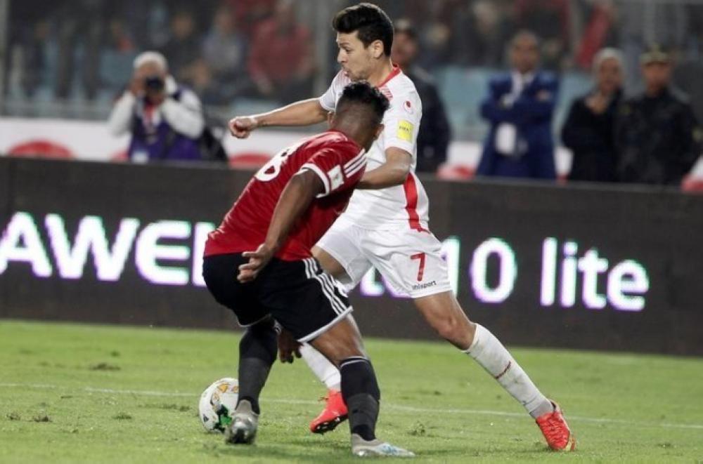 Tunisian's Youssef Msakni in action with Libya's Sanad during the African 2018 World Cup Qualifications match at - Rades Olympic Stadium, Rades, Tunisia. — Reuters