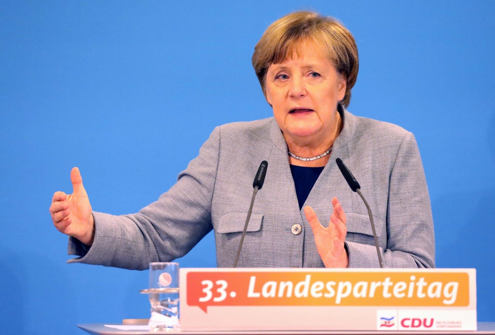 German Chancellor and leader of the Christian Democratic Union (CDU) party, Angela Merkel, speaks during a regional party conference in her home state of Mecklenburg Western Pomerania, in her first major speech since the collapse of coalition talks, in Kuehlungsborn, northern Germany, on Saturday. — AFP