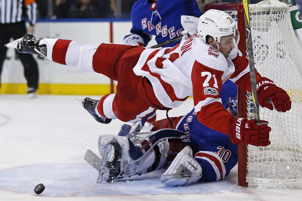 Detroit Red Wings center Dylan Larkin (71) is called for interference on New York Rangers goalie Henrik Lundqvist (30) during the third period at Madison Square Garden. — Reuters