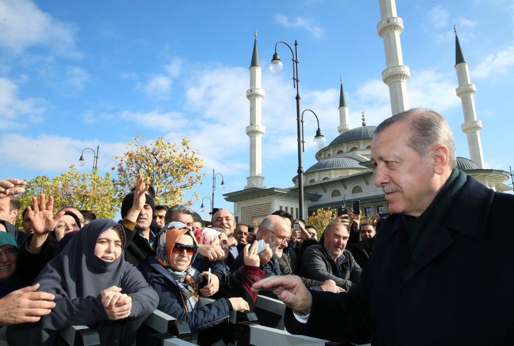 Turkish President Tayyip Erdogan greets his supporters after the Friday prayers in Ankara. — Reuters
