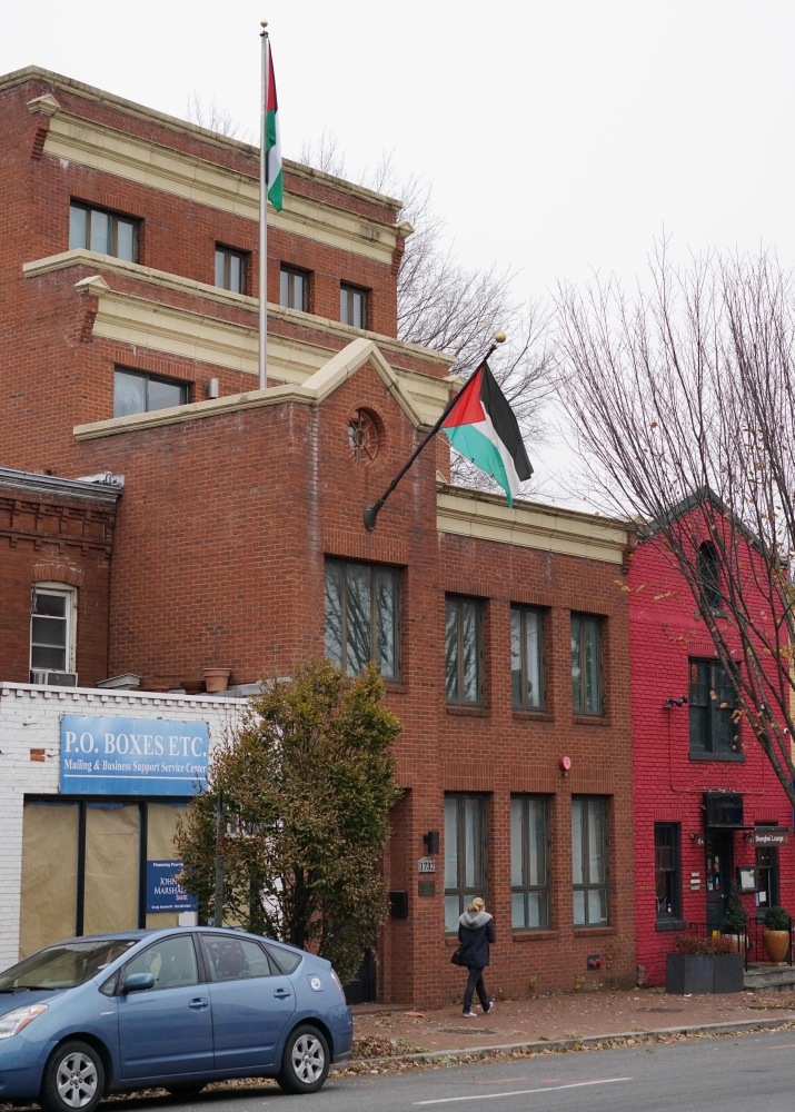 A pedestrian passes in front of the Palestine Liberation Organization offices in Washington, DC. — AFP