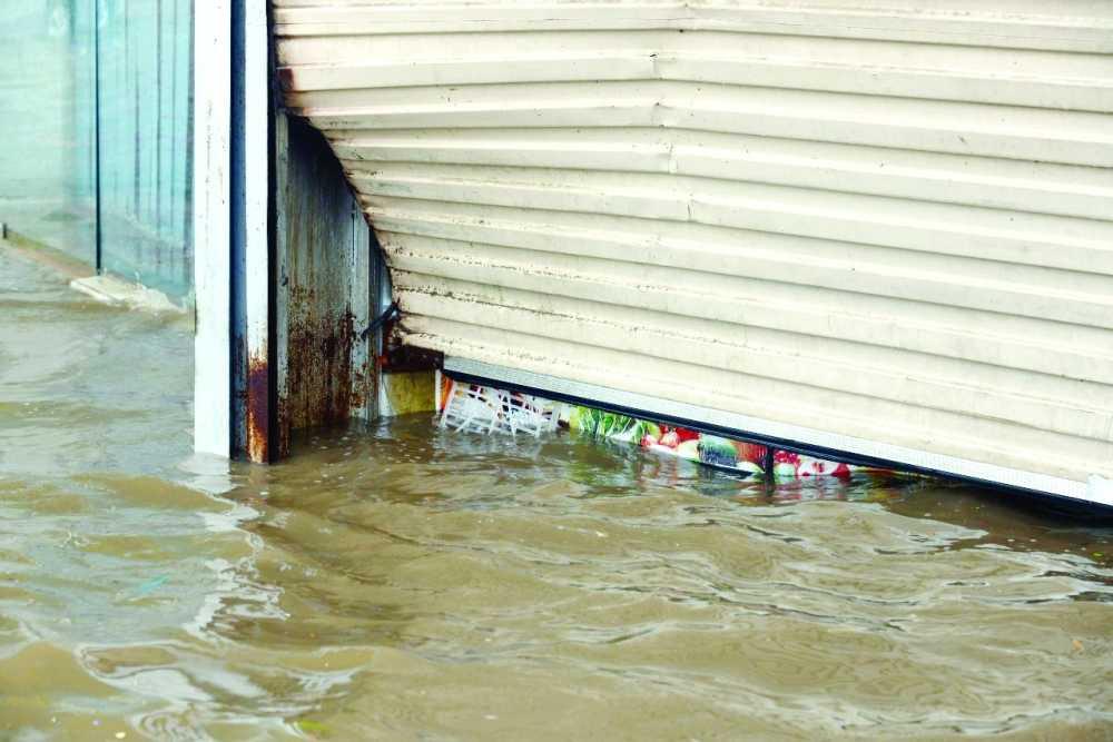 A commercial outlet inundated by floodwater following Tuesday's rain in Jeddah. — Courtesy Al-Madina