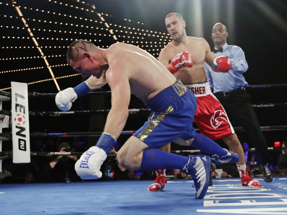 Russia's Sergey Kovalev knocks down Ukraine's Vyacheslav Shabranskyy during the first round of a light heavyweight title boxing match Saturday in New York. Kovalev stopped Shabranskyy in the second round. — AP