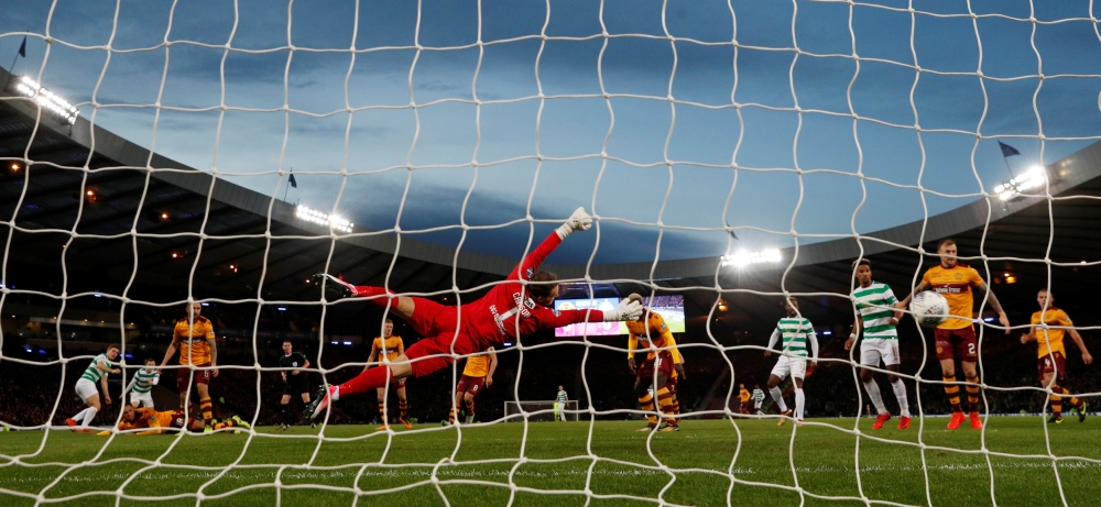 Celtic’s James Forrest scores their first goal against Motherwell during the Scottish League Cup Final at Hampden Park, Glasgow, on Sunday. — Reuters