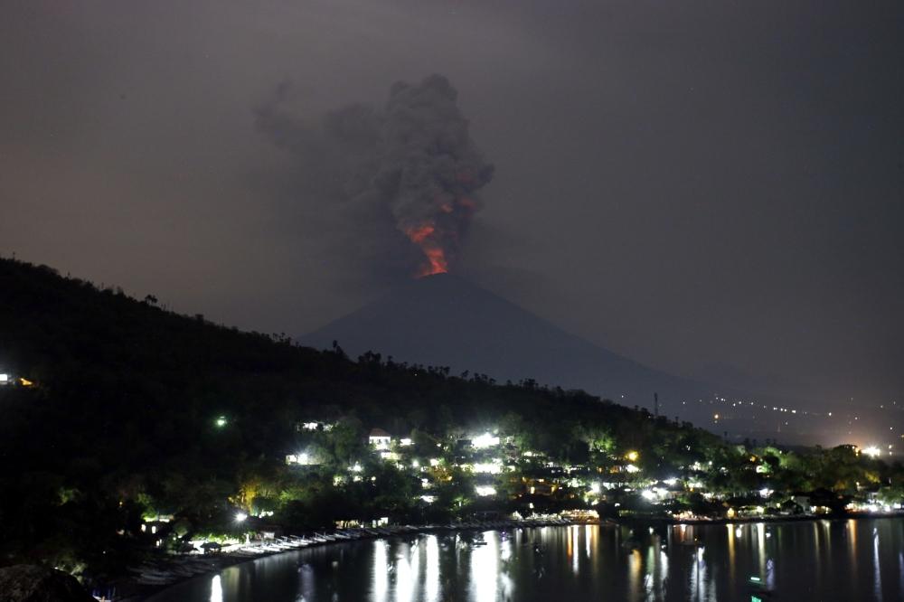 A view of the Mount Agung volcano erupting in Karangasem, Bali, Indonesia, Monday, Nov. 27, 2017.  — AP