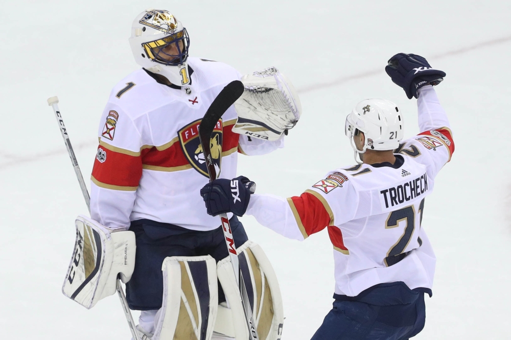 Florida Panthers goalie Roberto Luongo (1) and Florida Panthers center Vincent Trocheck (21) celebrate the Panthers win over the New Jersey Devils at Prudential Center. — Reuters