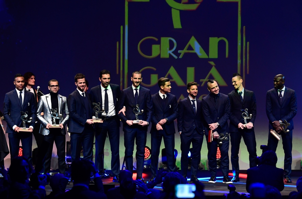 (From L) Juventus' Brazilian defender Alex Sandro, Paris Saint-Germain's Brazilian defender Dani Alves, Juventus' Bosnian midfielder Miralem Pjanic, Juventus' Italian goalkeeper Gianluigi Buffon, former Juventus defender Leonardo Bonucci, Juventus' Argentinian forward Paulo Dybala, Napoli's Belgian striker Dries Mertens, AS Roma's Belgian midfielder Radja Nainggolan, Napoli's Slovakian midfielder Marek Hamsik and Napoli's French defender Kalidou Koulibaly pose with their awards at the 