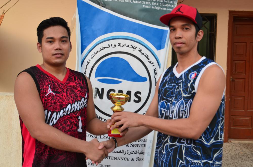 William Javier of Al Yamamah receives his best player award from Rudy Opena of SAGCO