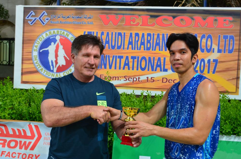 William Javier of Al Yamamah receives his best player award from Rudy Opena of SAGCO