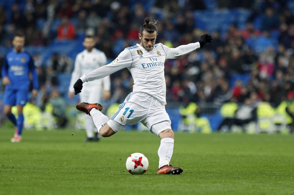 Real Madrid's Gareth Bale shoots the ball during a Spanish Copa del Rey round of 32 second leg soccer match against Fuenlabrada at the Santiago Bernabeu stadium in Madrid, Tuesday. Real Madrid won 4-2 on aggregate. — AP
