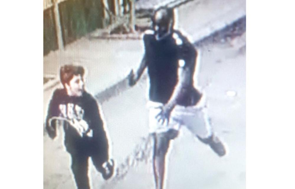

A video clip that went viral shows a man chasing two boys (another out of the frame) with a cleaver.