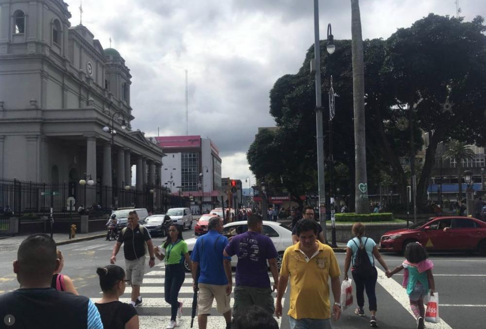 Pedestrian cross a street in San Jose, Costa Rica, in this file photo. — Reuters