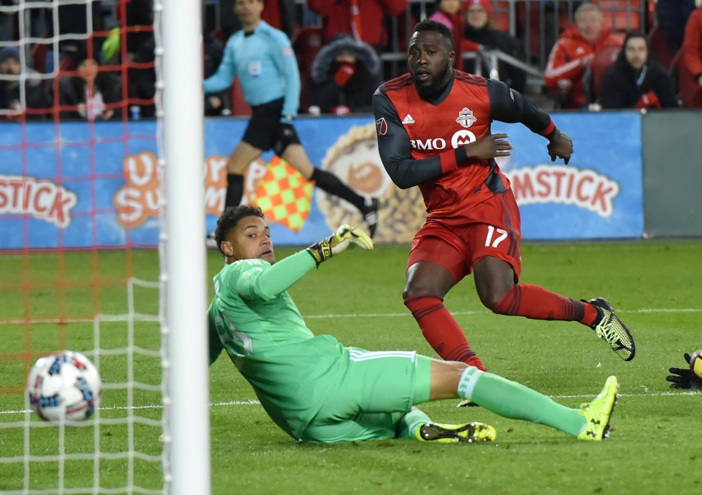 Toronto FC forward Jozy Altidore (17) scores against Columbus Crew goalkeeper Zack Steffen (23) in the second leg of the Eastern Conference championship at BMO Field. — Reuters