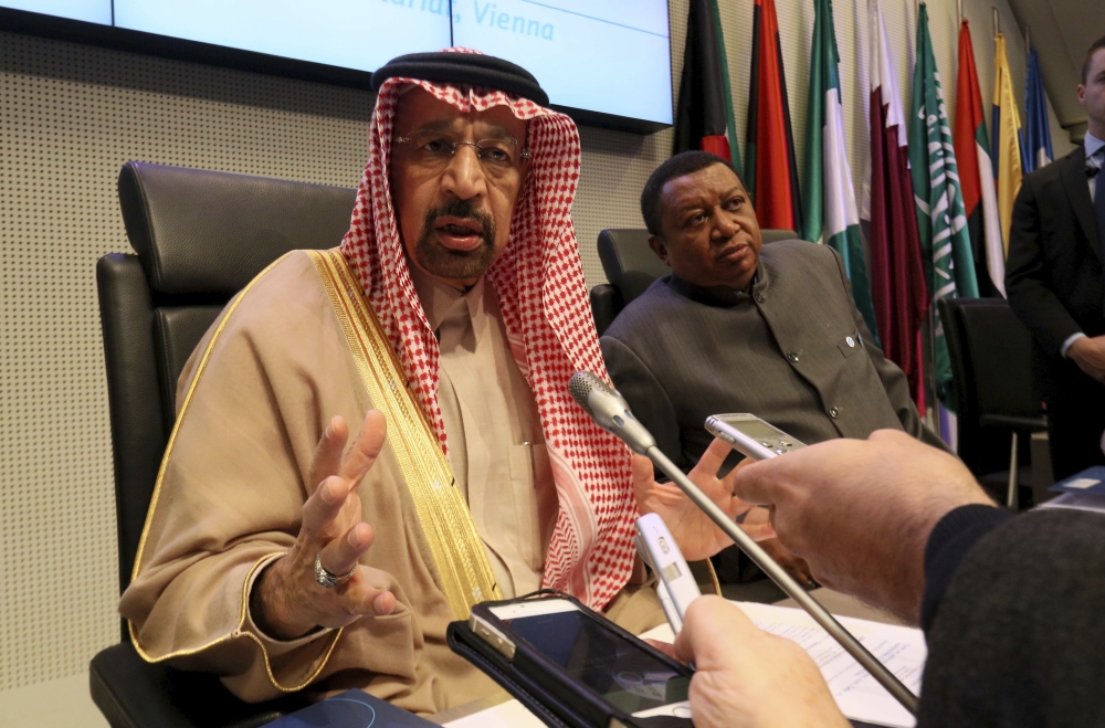 Khalid Al-Falih, minister of energy, industry and mineral resources and president of the OPEC Conference of Saudi Arabia, left, and Mohammad Sanusi Barkindo, OPEC secretary general of Nigeria, speak to journalists prior to the start of a meeting of the Organization of the Petroleum Exporting Countries (OPEC) at their headquarters in Vienna, Austria, Thursday. — AP