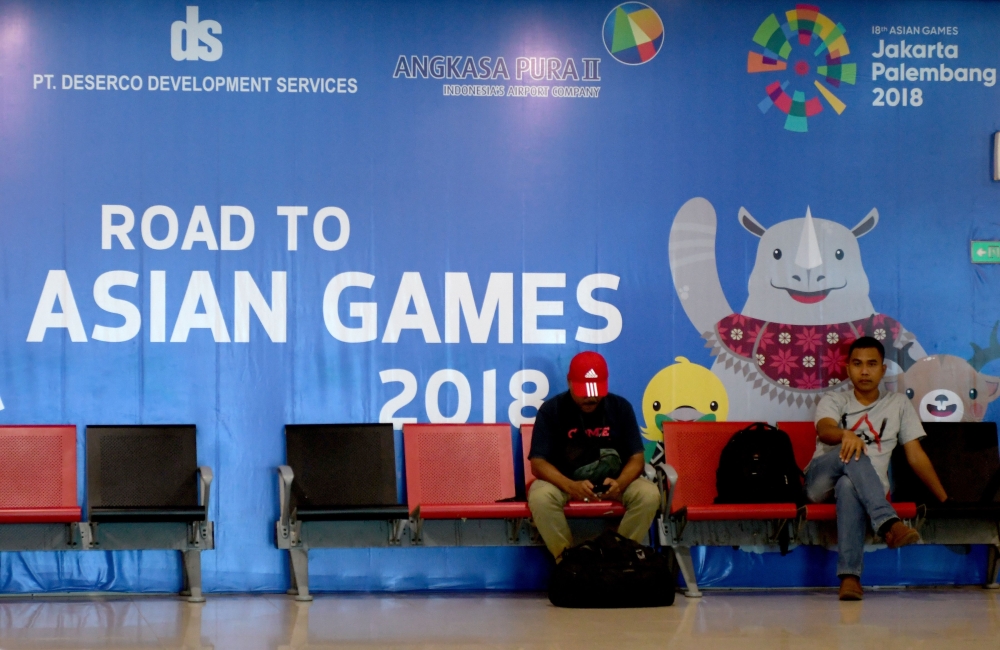 This picture shows a signboard for the 2018 Asian Games at the airport in Palembang. Half-finished venues and an air of unpreparedness raise an uncomfortable question for Indonesia: will it be ready for next year's Asian Games? — AFP