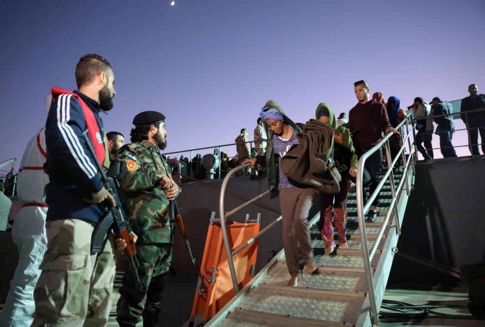 African migrants packed into the Tariq Al-Matar detention center on the outskirts of Tripoli, Libya. — AFP 