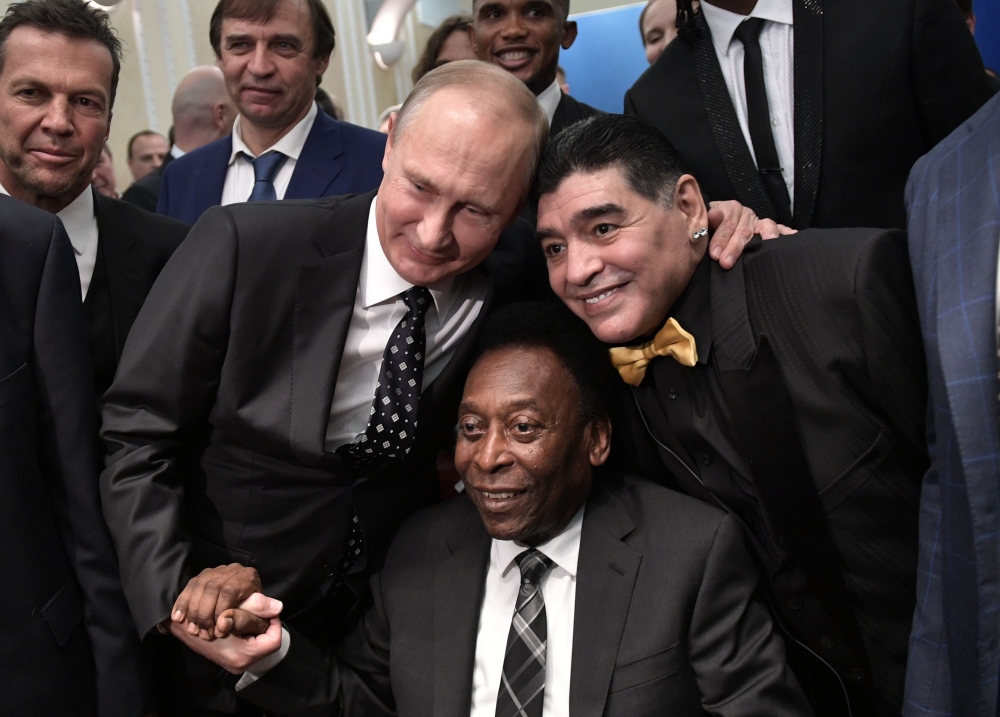 Russian President Vladimir Putin, Brazilian football legend Pele and Argentina's former midfielder Diego Maradona pose for pictures ahead of the Final Draw for the 2018 FIFA World Cup football tournament at the State Kremlin Palace in Moscow on Friday. — AFP