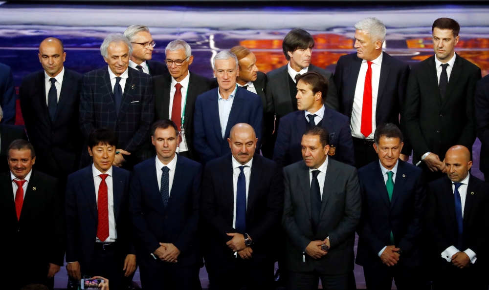 The nations coaches pose for a photo after the  2018 FIFA World Cup Draw draw at the State Kremlin Palace, Moscow, Russia, on Friday.  — Reuters