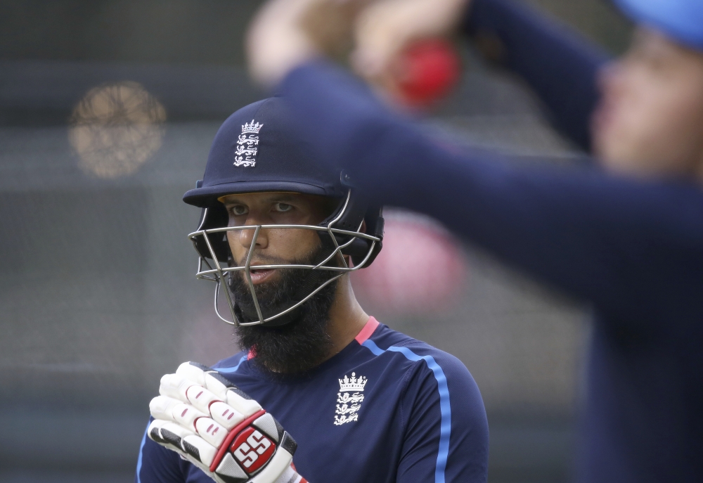 England's Moeen Ali waits to bat as a teammate runs past to bowl in the nets as the England team trains for their next Ashes Test match in Adelaide, Friday. — AP