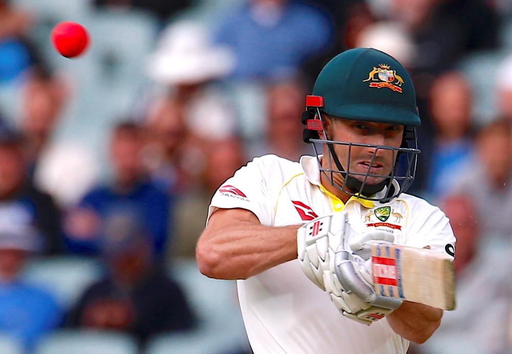 Australia's Shaun Marsh hits a boundary to reach his century during the second day of the second Ashes cricket Test match against England at the Adelaide Oval, Adelaide, Australia, Sunday. — Reuters