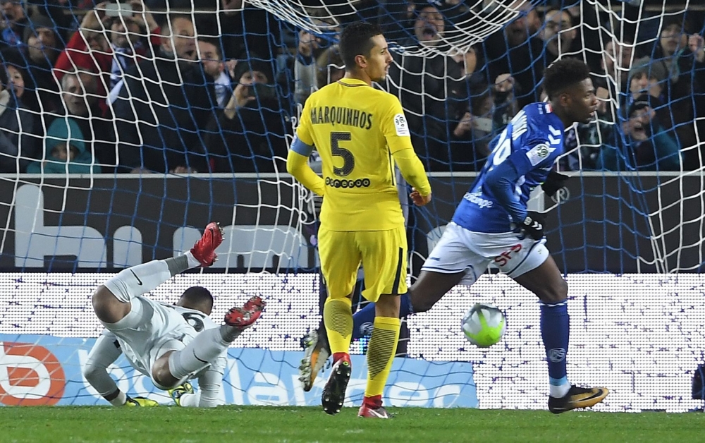 Strasbourg's Cape Verdian forward Nuno Da Costa (R) reacts as he scores a goal past Paris Saint-Germain's French goalkeeper Alphonse Areola (L) while Paris Saint-Germain's Brazilian defender Marquinhos (C) reacts during the French L1 football match between Strasbourg and PSG at the Meinau Stadium in Strasbourg, eastern France, on Saturday. — AFP