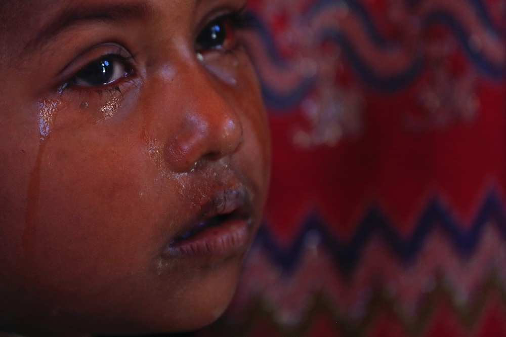 A Rohingya child cries at UNICEF medical centre at Balukhali refugee camp near Cox’s Bazar, Bangladesh, on Monday. — Reuters