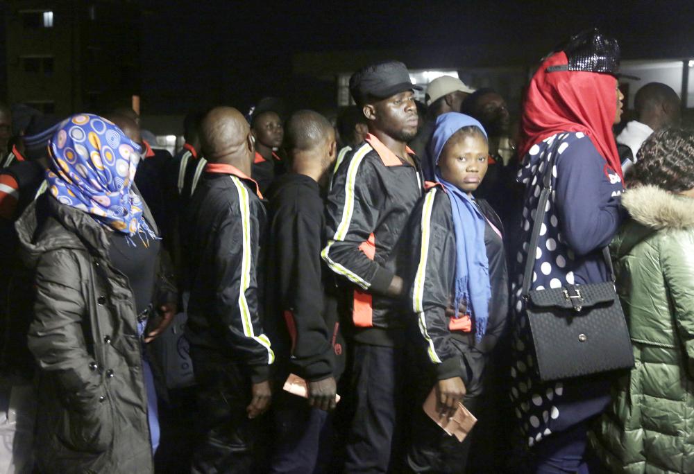 Nigerian returnees from Libya wait to be registered by officials upon arrival at the Murtala Muhammed International Airport in Lagos, Nigeria, on Tuesday. — AP