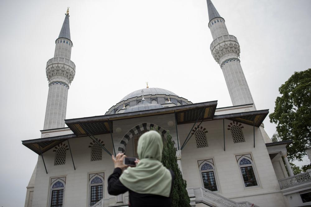 A woman takes a picture of Sehitlik Mosque in Berlin, Germany. — Reuters