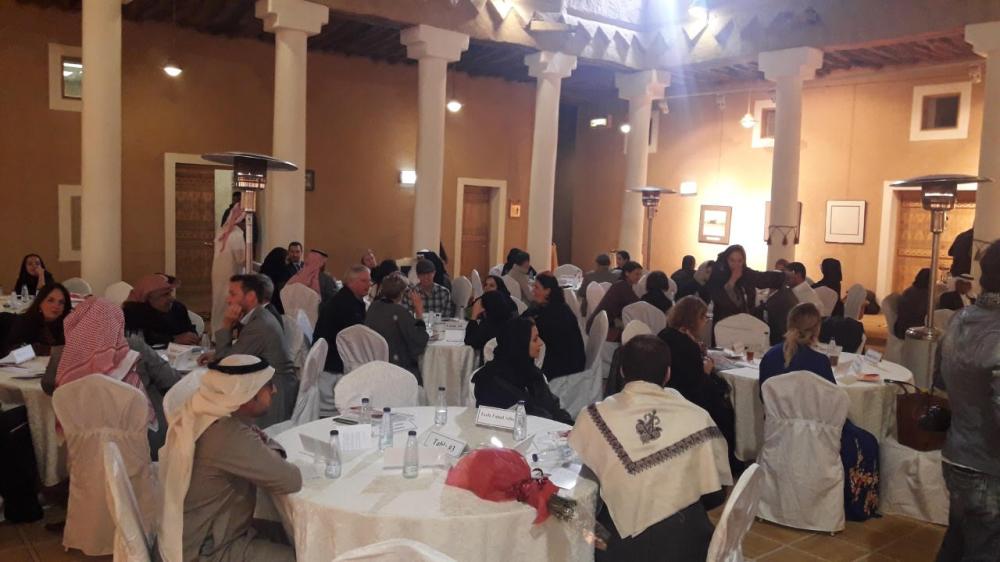 Participants engage in roundtable discussions at the cross-cultural dialogue.