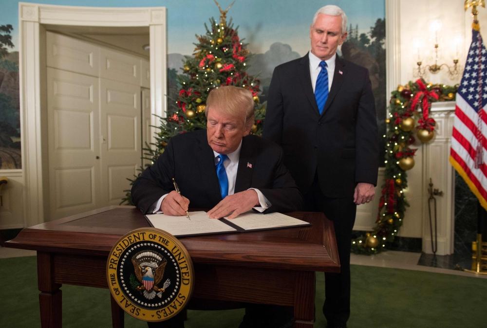  US President Donald Trump, flanked by ‪Vice President Mike Pence‬, delivers remarks recognizing Jerusalem as the capital of Israel at the White House in Washington, US on Wednesday.  — Reuters