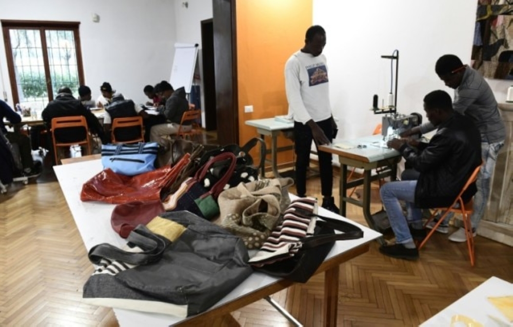 Handbags made by migrants at the Lai-Momo headquarters, a vocational training program to teach skills in leather bag making to those seeking asylum in Italy. — AFP photos