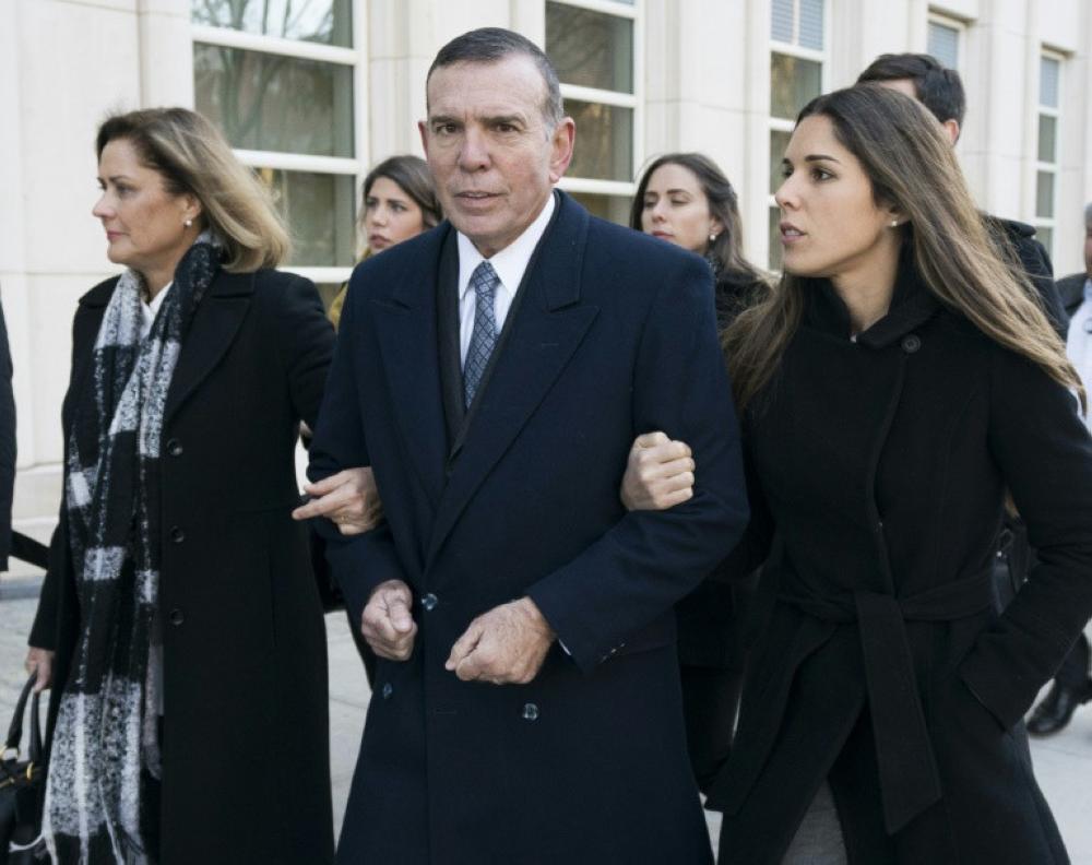 Former South American Football Confederation (CONMEBOL) president Juan Angel Napout arrives with family last month at the court in Brooklyn, New York. — AFP