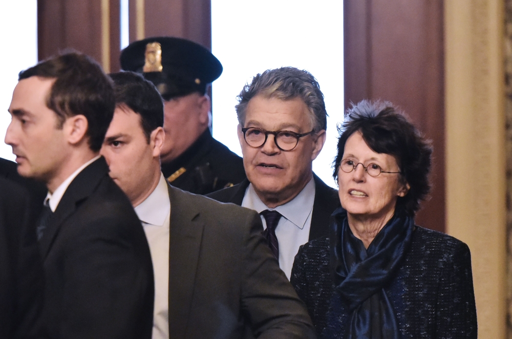 Senator Al Franken, D-MN, and his wife Franni Bryson (R) arrive at the US Capitol on Thursday in Washington, DC. Franken announced that he will be resigning in the coming weeks. Franken — a former comedian who made his name on the popular late-night comedy show 
