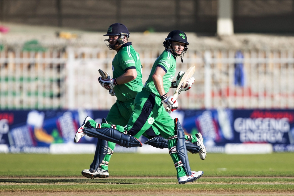 Ireland's bastmen William Porterfield (R) and Paul Stirling run between the wickets during 2nd One Day International (ODI) cricket match against Afghanistan at Sharjah Cricket Association Stadium in Sharjah on Thursday. — AFP